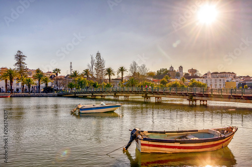 The sun shines over the Portuguese village of Tavira on the banks of river Gilao.