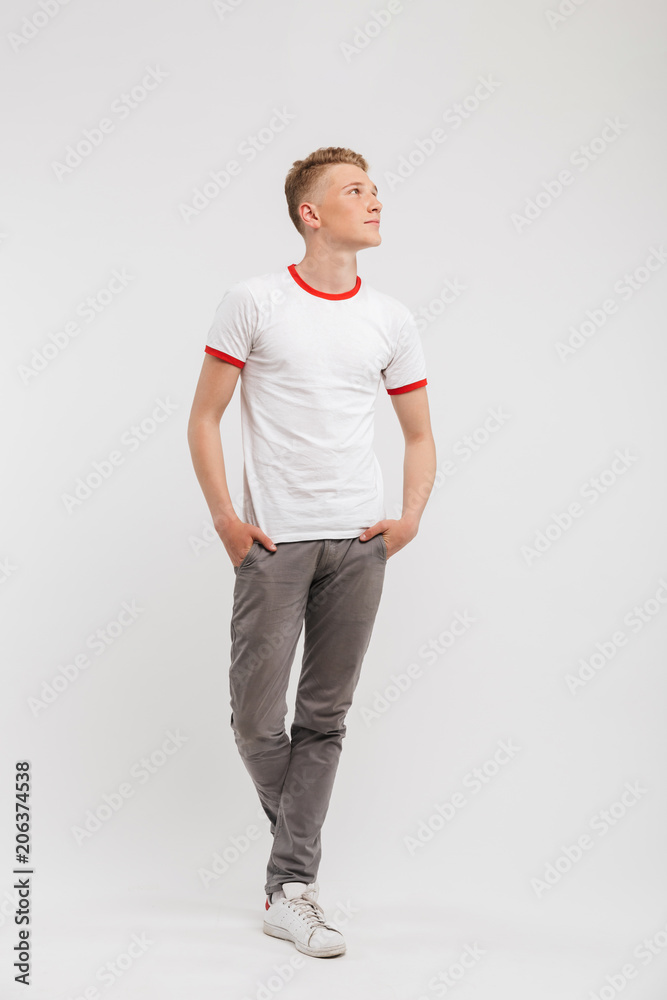 Full length portrait of a smiling teenage boy Full length portrait of a smiling teenage boy