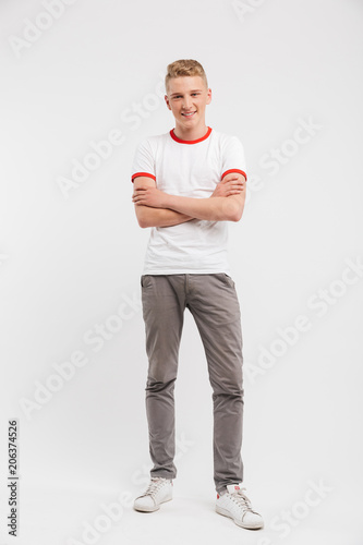 Full length portrait of a smiling teenage boy