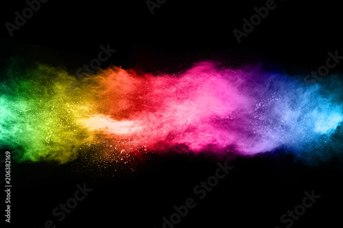 Multicolor powder explosion on black background. 