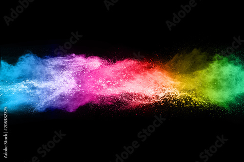 Multicolor powder explosion on black background. 