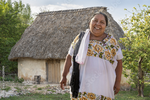 Photos Traditional Mayan Clay House with smiling woman