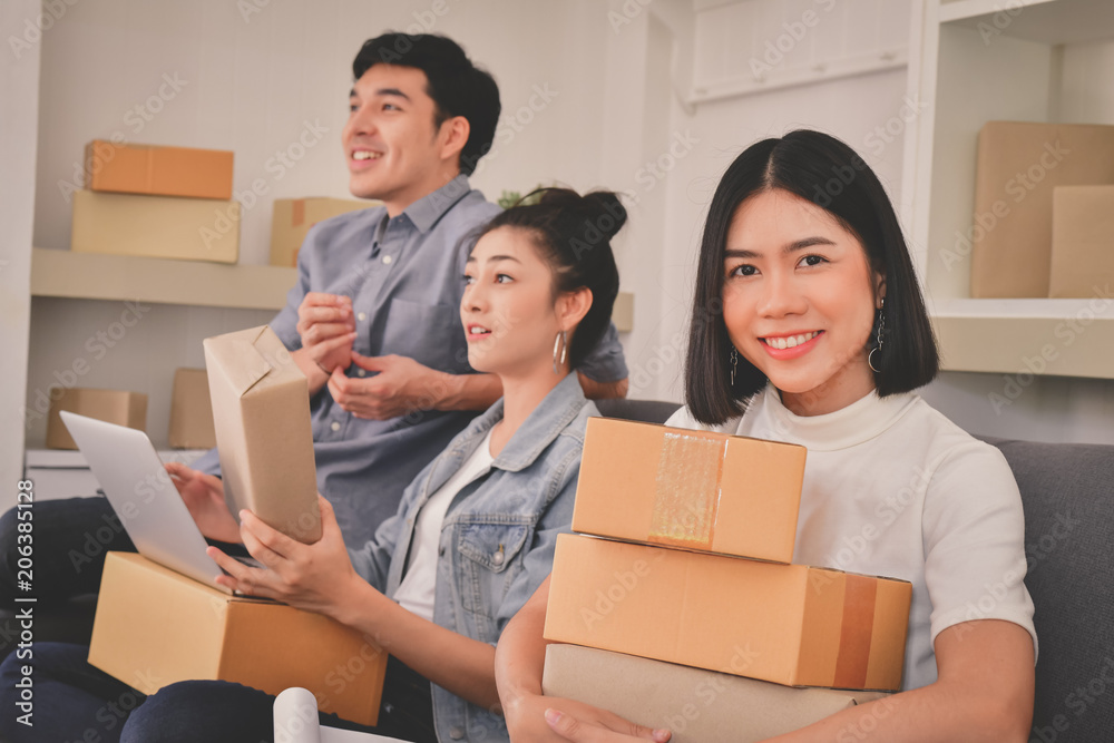 Sme business concept. Young Asian people are packing their packages.Delivery business Small and Medium Enterprise (SMEs). Young man is working in the house.Young Owner Start up for Business Online. Sme business concept. Young Asian people are packing their packages.Delivery business Small and Medium Enterprise (SMEs). Young man is working in the house.Young Owner Start up for Business Online.