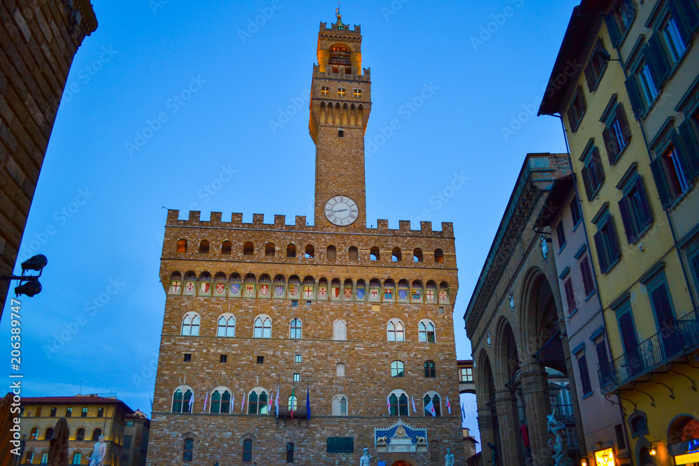 Illuminated Palazzo Vecchio (Old Palace) in Piazza della Signoria at evening. Florence, Italy.