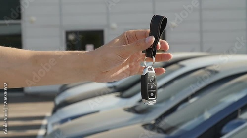 Keys on the background of a row of cars photo
