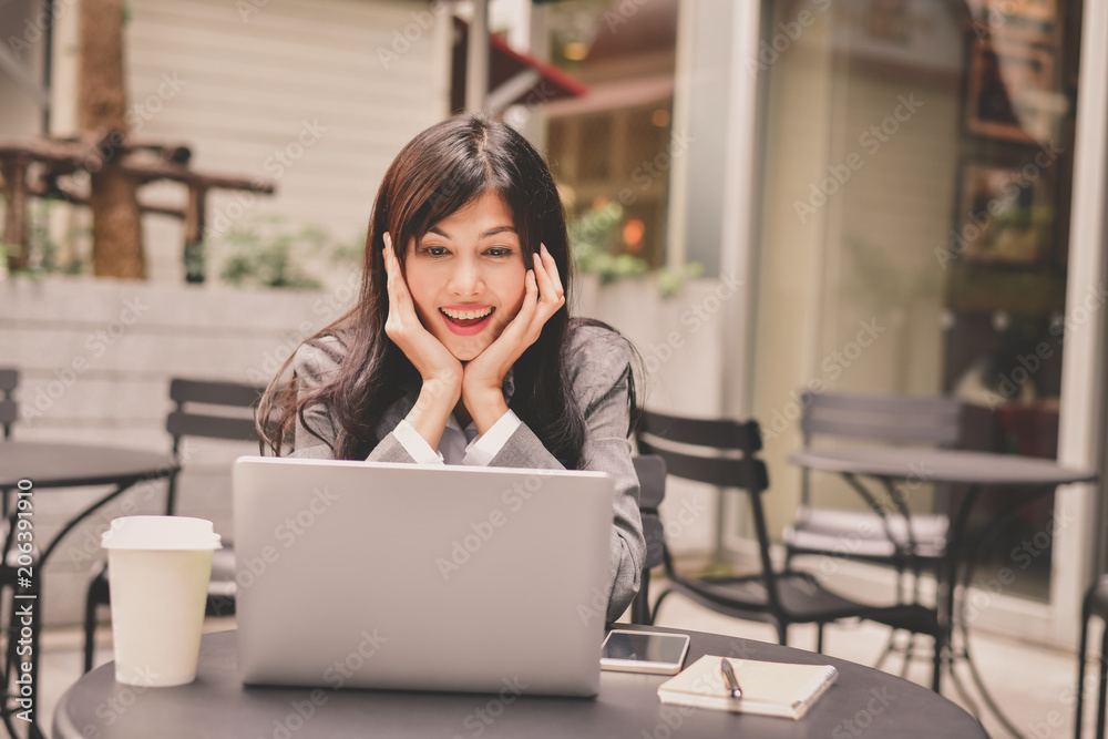 Business Concept.Young Asian businesswoman is working happily.Young businesswoman working in a cafe.Young businesswoman is relaxation in a coffee shop. Business Concept.Young Asian businesswoman is working happily.Young businesswoman working in a cafe.Young businesswoman is relaxation in a coffee shop.