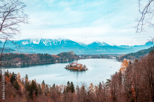 View of Bled Lake during Autumn with Bled Castle and snow and mountains in background, Bled Lake, Slovenia © Daniel