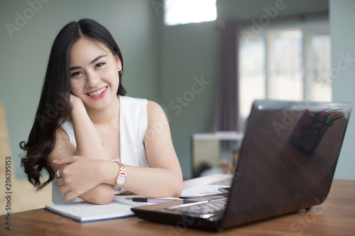 Beautiful young Asia woman working in office