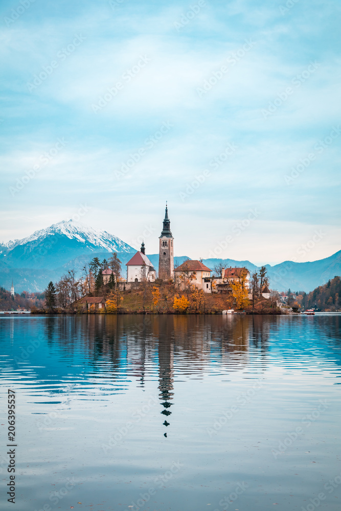 View of Bled Lake during Autumn with Bled Castle and snow and mountains in background, Bled Lake, Slovenia