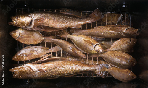 Smoked fish ( Seatrout, pinfish, Atlantic Croaker) on the grill photo