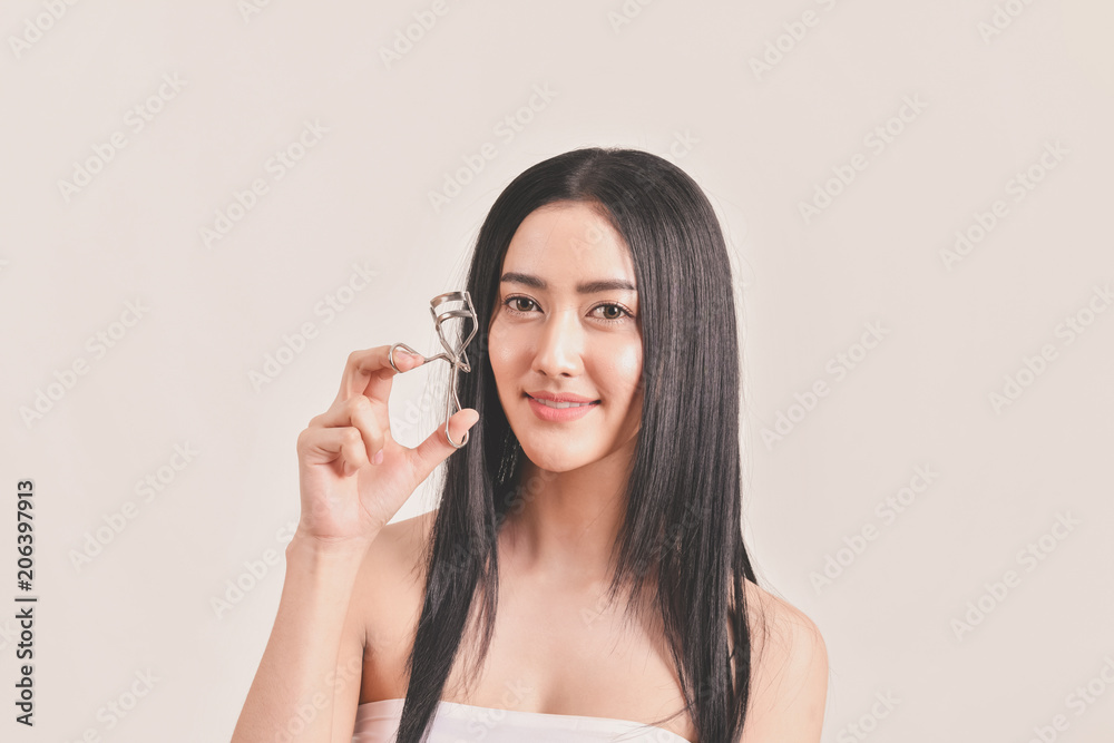 The concept of healthy beautiful woman. Beautiful girl Make up with cosmetics. Beautiful women use cosmetics suitable for the face. Beautiful woman makeup on isolated background The concept of healthy beautiful woman. Beautiful girl Make up with cosmetics. Beautiful women use cosmetics suitable for the face. Beautiful woman makeup on isolated background