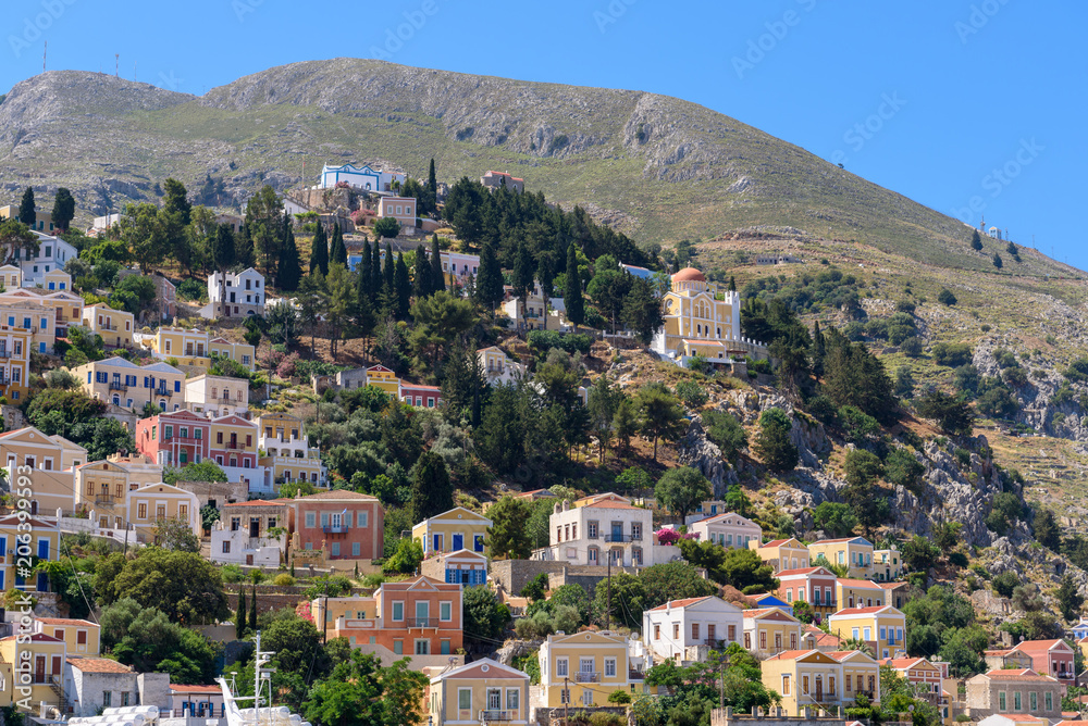 Colorful houses on the hillside of the island of symi. Greece