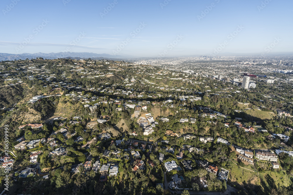 Aerial view of hillside and canyon homes above Beverly Hills, West Hollywood and Los Angeles in scenic Southern California.  