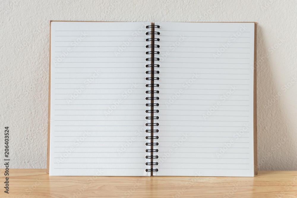 Blank open note book in wooden table Blank open note book in wooden table