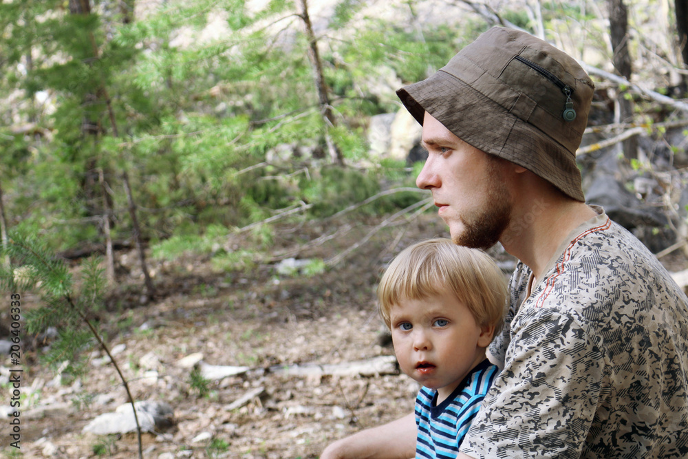 Portrait of father and son outdoors