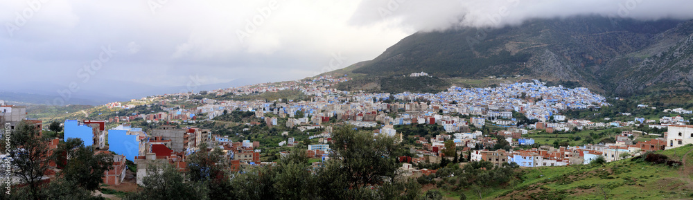 Panoramic view of Chefchaouen, one of the most touristic towns in Morocco, on a cloudy day