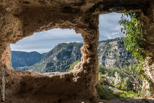 Interior of a tomb in Pantalica, a necropolis in Sicily photo