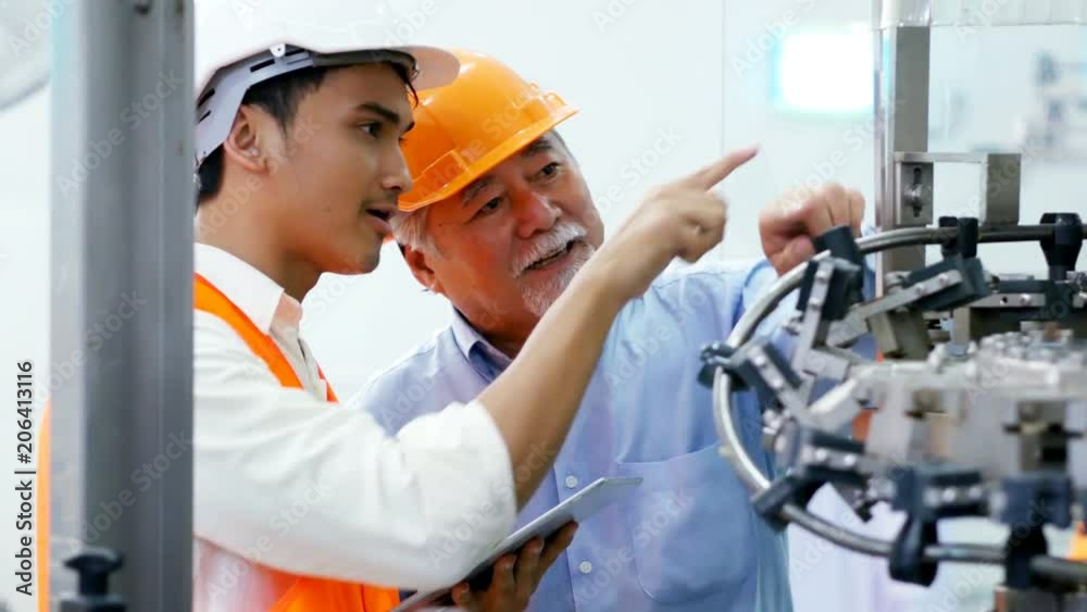 Engineer talking for project on the factory floor. People working concept. Engineer talking for project on the factory floor. People working concept.