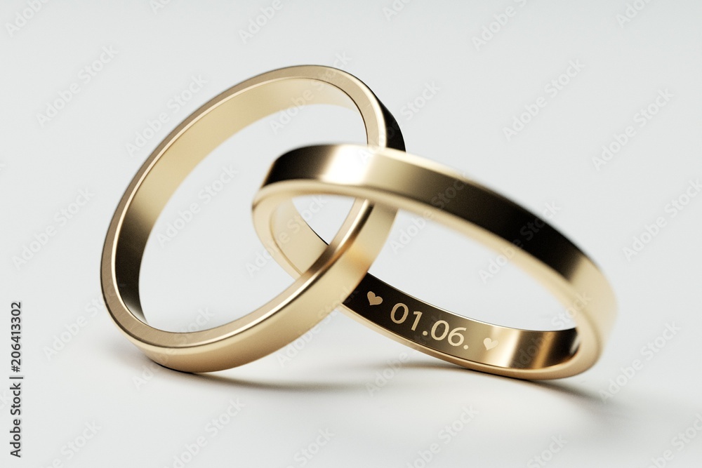 Isolated golden wedding rings with date 1. June Isolated golden wedding rings with date 1. June