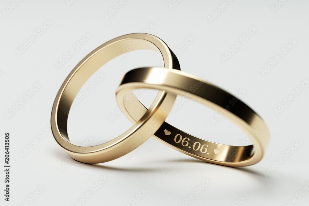 Isolated golden wedding rings with date 6. June Isolated golden wedding rings with date 6. June