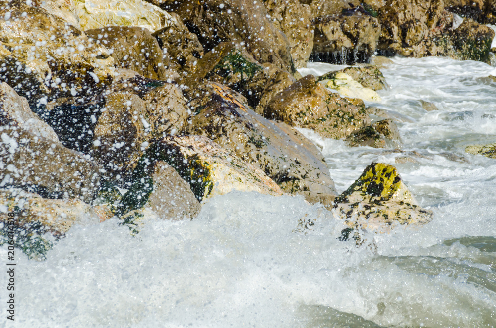 Amazing sea with blue summer wave and rocks, relaxing view of rocks and water Amazing sea with blue summer wave and rocks, relaxing view of rocks and water
