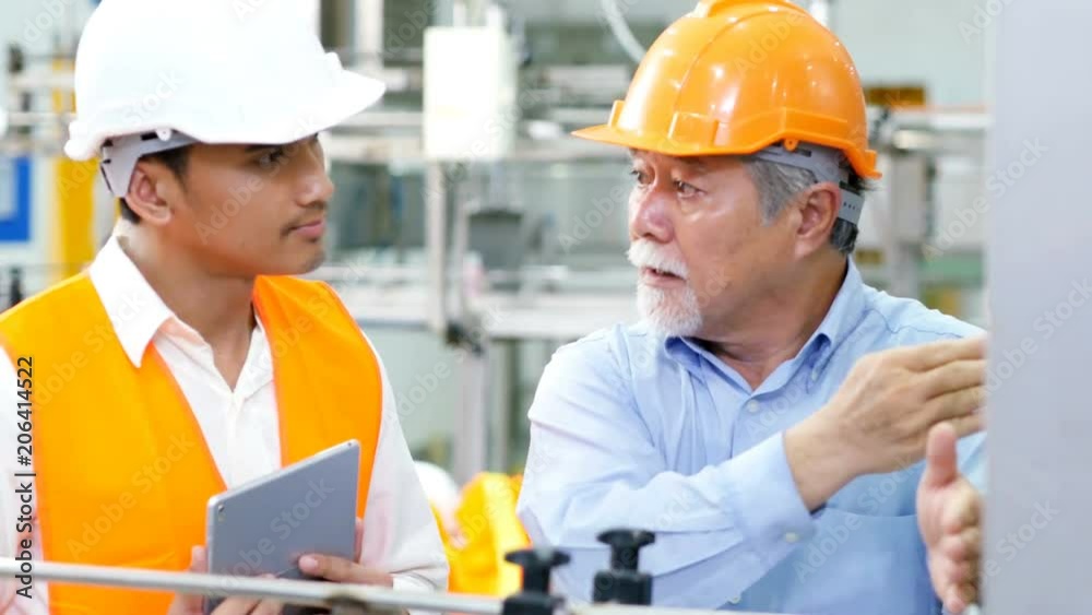 Engineer talking for project on the factory floor. People working concept. Engineer talking for project on the factory floor. People working concept.