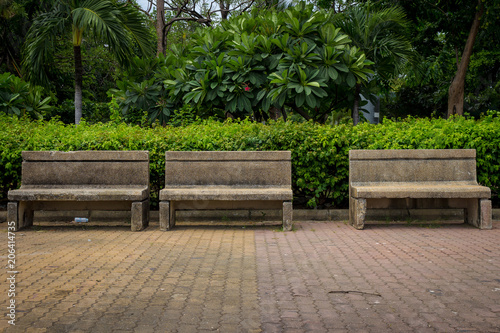 Fototapeta Naklejka Na Ścianę i Meble -  chair cement public park with litter. garbage. leaf. chair dirty. empty