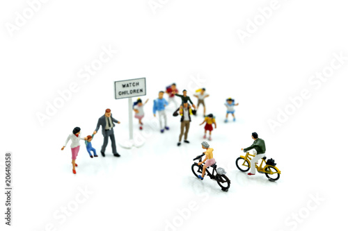 Miniature people : student or children crossing road on way to school,Back to school concept.