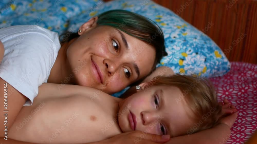 Young Mother and daughter having fun in bedroom , 4k slow motion clip. Young Mother and daughter having fun in bedroom , 4k slow motion clip.