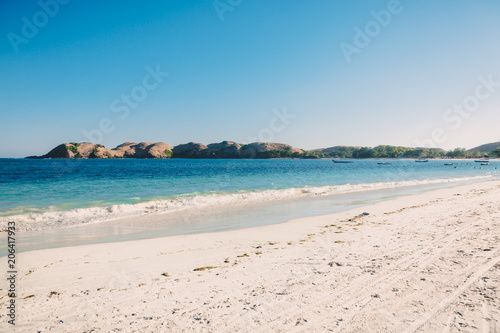 Tropical white beach with blue ocean in tropics