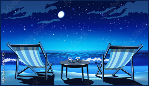 Two chaise lounges on the beach at night