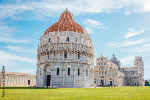Pisa Baptistery of St. John and Cathedral and Leaning Tower of Pisa in Italy photo