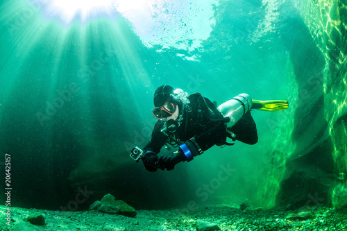 Diving in Verzasca river, Ticino, Switzerland