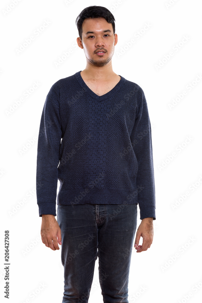 Fototapeta premium Studio shot of young Asian man standing