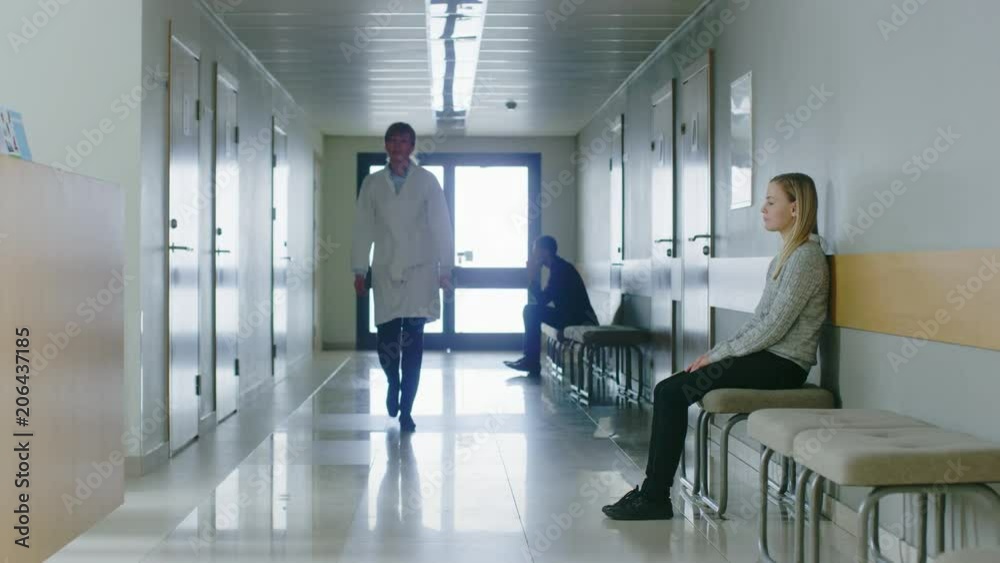 Following Shot of the Doctor Walking Through Hospital Hallway. Shot on RED EPIC-W 8K Helium Cinema Camera. Following Shot of the Doctor Walking Through Hospital Hallway. Shot on RED EPIC-W 8K Helium Cinema Camera.