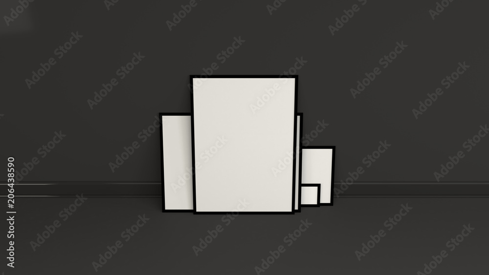 Blank white posters in black frames standing on the floor Blank white posters in black frames standing on the floor