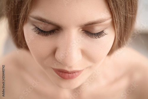 Attractive young woman with beautiful eyelashes  closeup