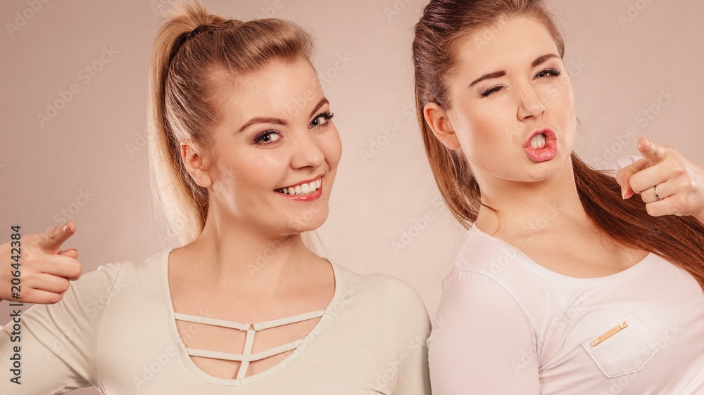 Two happy women friends motivating Two happy women friends motivating