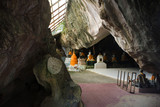 Buddha statue in caves at Wat Khuha Sawan in Phatthalung, Thailand.