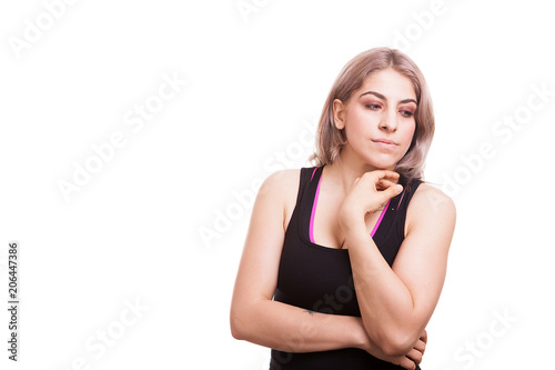 Woman posing to the camera in sport clothes isolated on white background