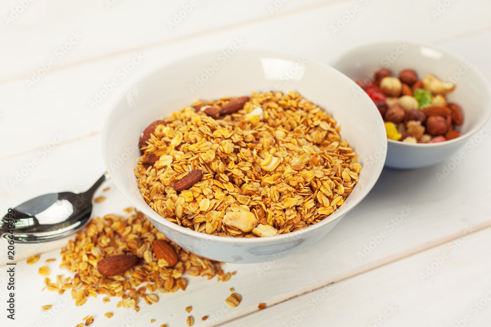 Food background of fresh baked homemade granola in bowl Food background of fresh baked homemade granola in bowl