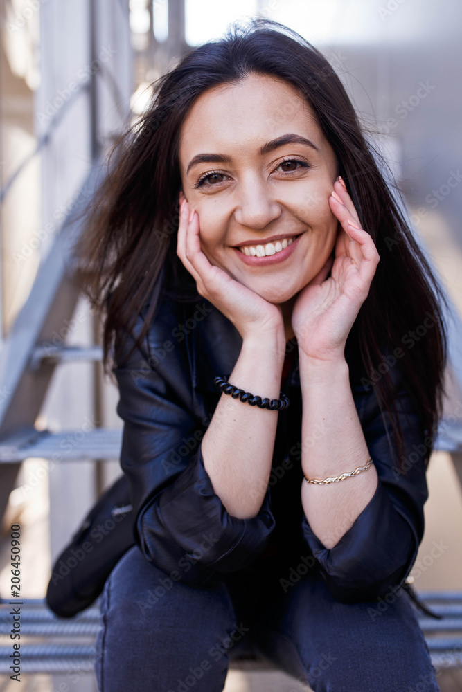 A portrait of a charismatic and charming girl of Caucasian appearance widely smiles and looks at the cameras. Portrait. Positive. A portrait of a charismatic and charming girl of Caucasian appearance widely smiles and looks at the cameras. Portrait. Positive.