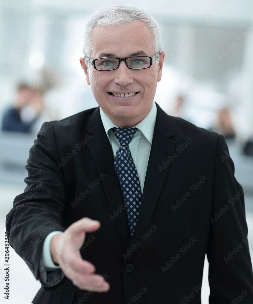 Fototapeta premium closeup of a senior businessman offering his hand for greeting.