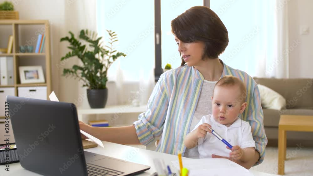 multi-tasking, freelance and motherhood concept - working mother with baby boy at home office multi-tasking, freelance and motherhood concept - working mother with baby boy at home office
