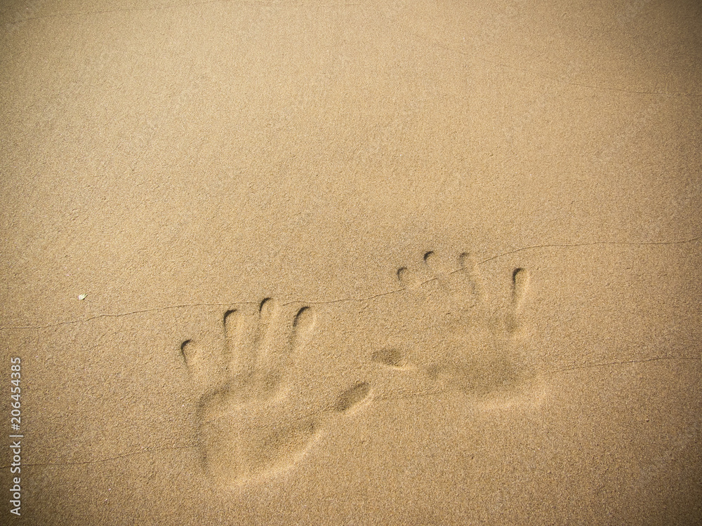playing with sand long the shoreline playing with sand long the shoreline