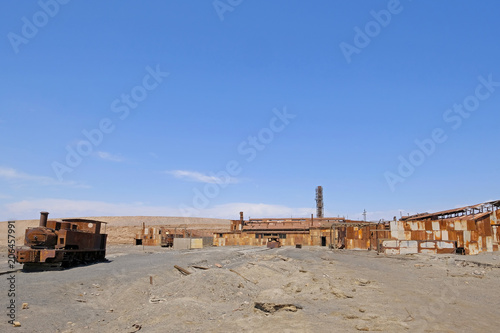 Abandoned Humberstone and Santa Laura saltpeter works factory, near Iquique, northern Chile, South America. This abandoned nitrate town was extremely important for the early economy of Chile. photo