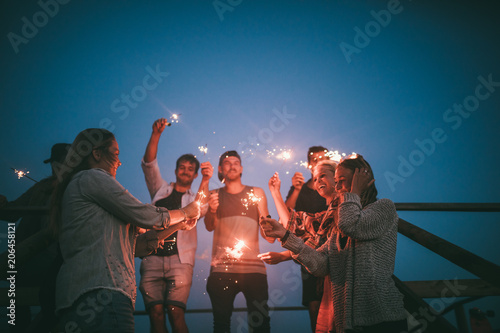 celebrating summernight with friends and sparklers photo
