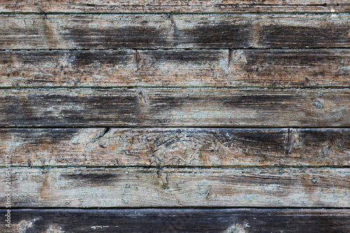 Vintage wood background with peeling grunge paint.