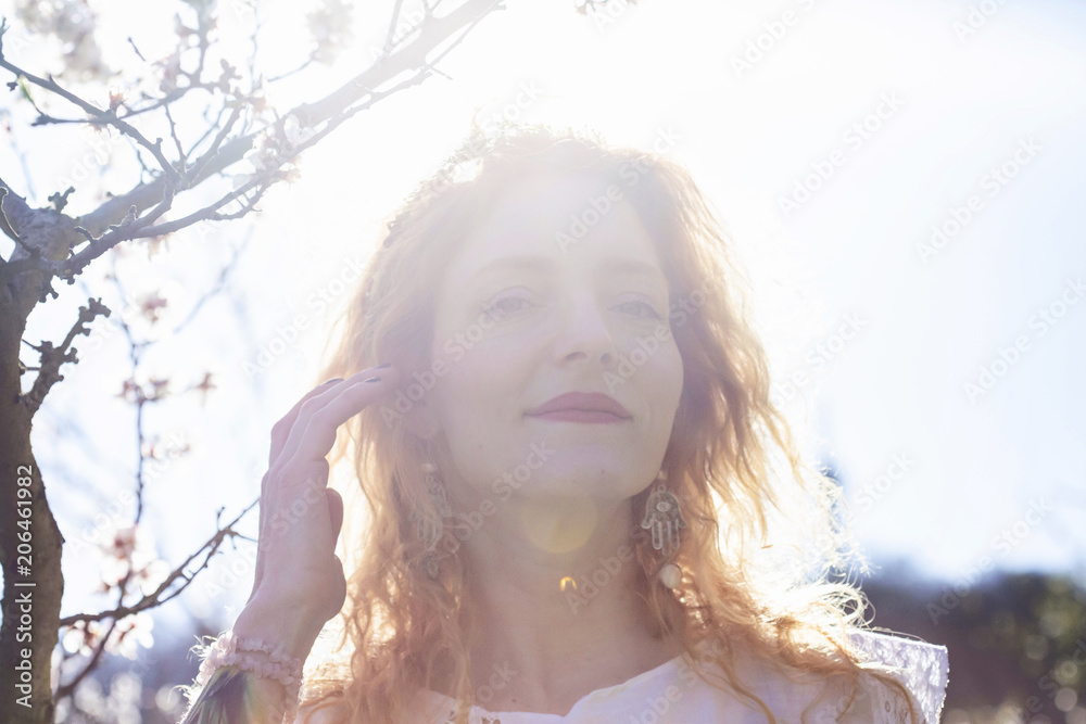 Beautiful woman in spring light garden Beautiful woman in spring light garden