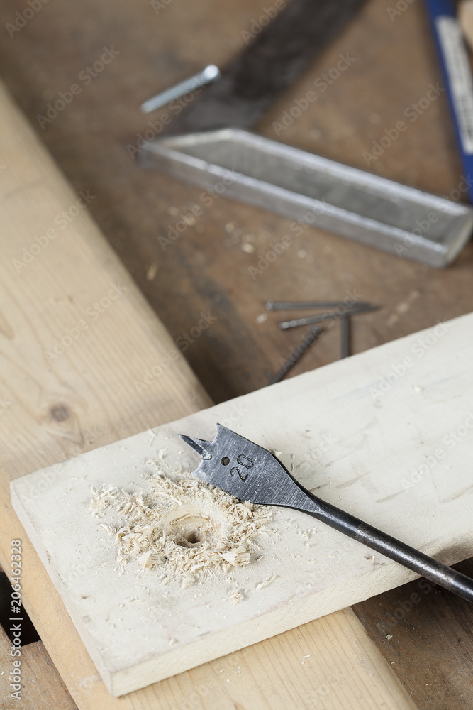 flat wood drill. carpenter. copy space flat wood drill. carpenter. copy space